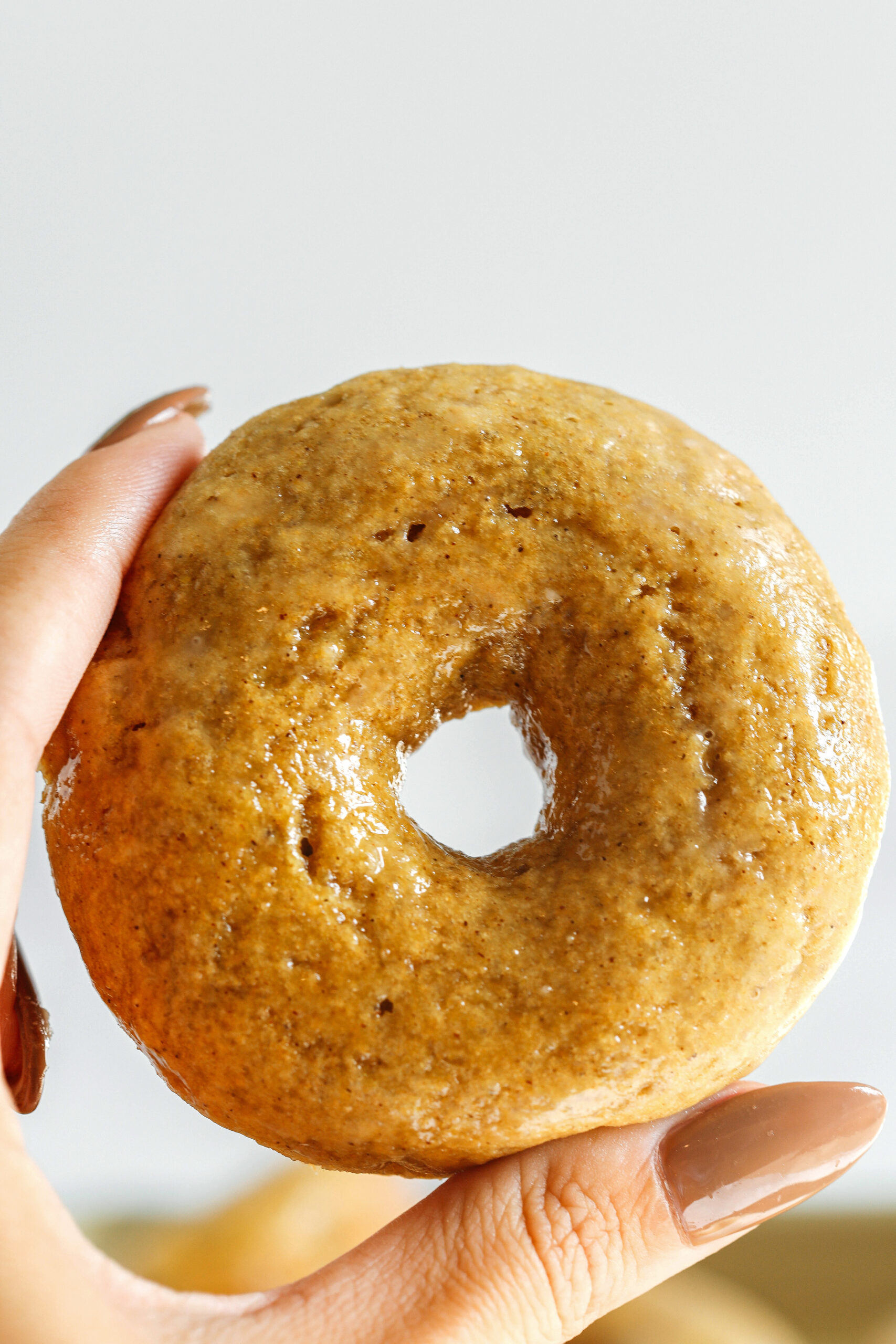 These Baked Banana Bread Donuts are soft, cake-like and made healthier with whole wheat flour, applesauce and zero refined sugar for the perfect morning treat that comes together in just 20 minutes!  Such a great way to use up those overripe bananas!