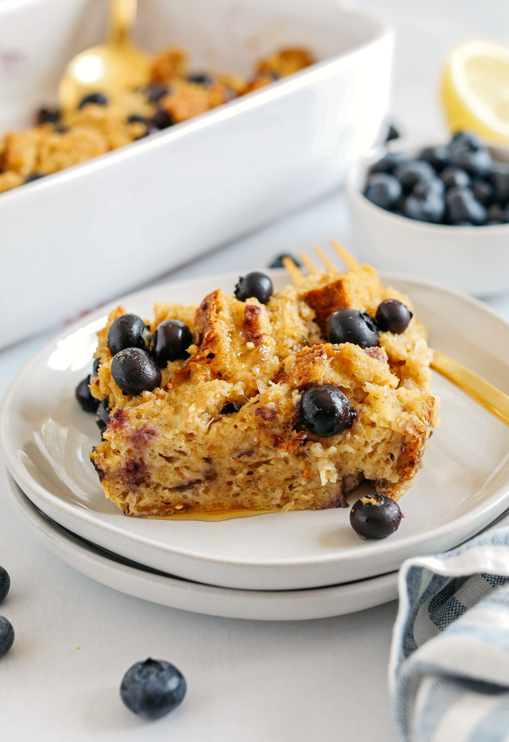 Warm and delicious Blueberry Lemon Bread Pudding lightened up with healthier ingredients and zero butter or refined sugar!  The perfect cozy dish for breakfast, brunch or dessert!