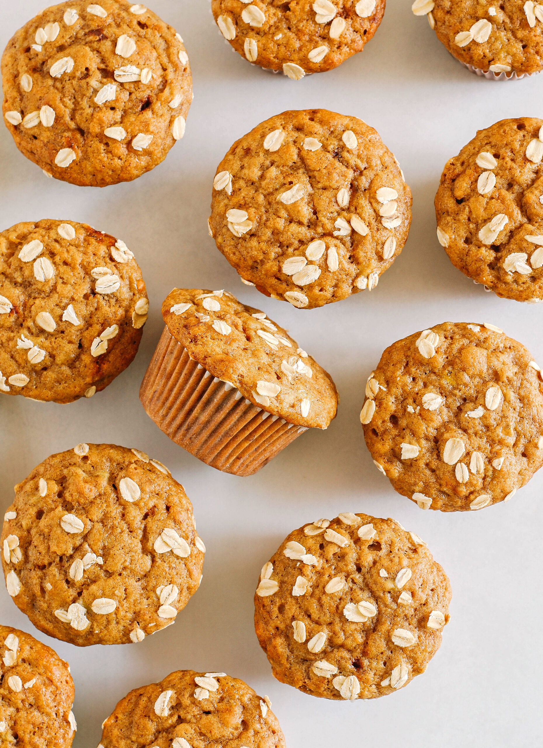 These Banana Breakfast Muffins are moist, fluffy, and made healthier with whole wheat flour, Greek yogurt, and zero butter or refined sugar.  Loaded with delicious banana flavor and warm spices for the perfect morning muffin!