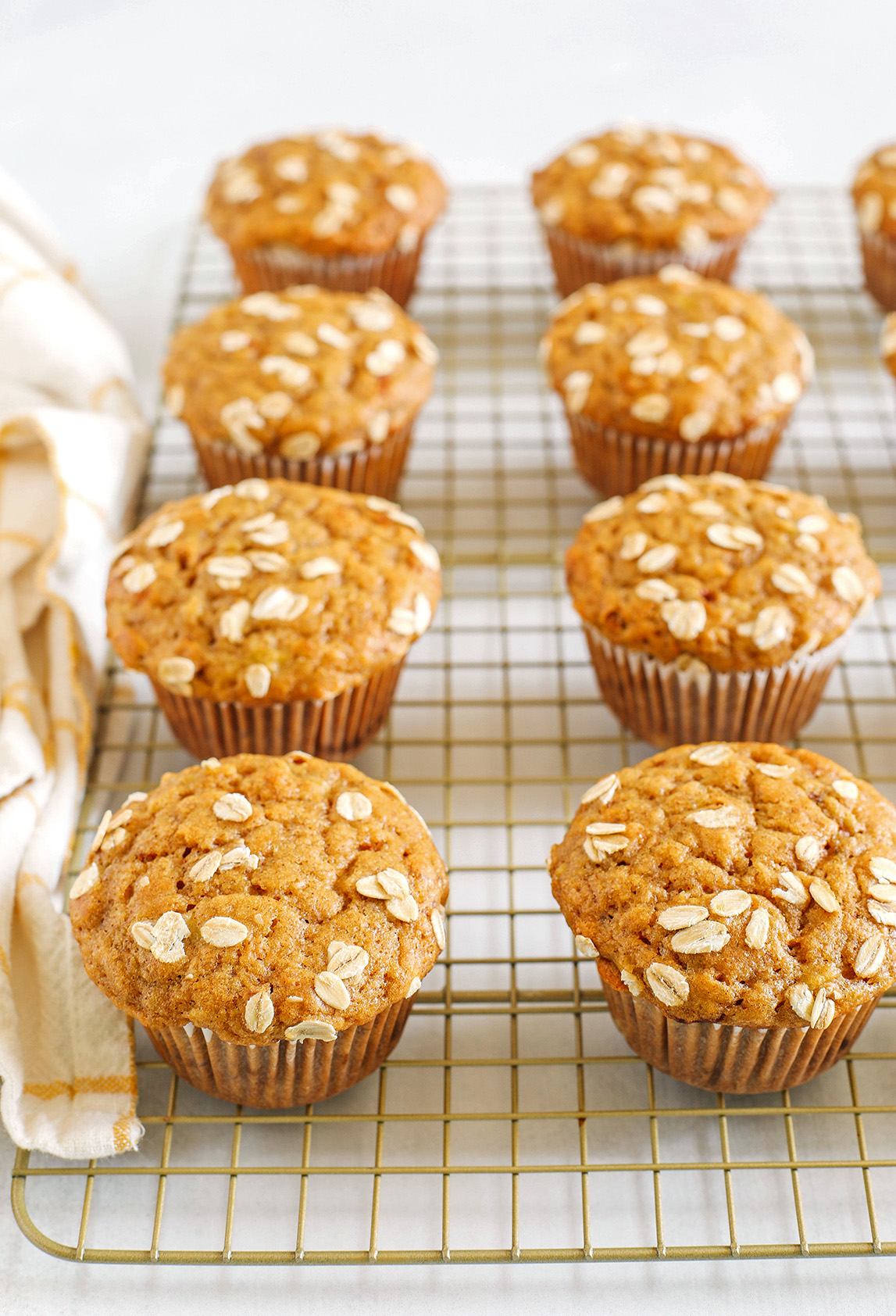 These Banana Breakfast Muffins are moist, fluffy, and made healthier with whole wheat flour, Greek yogurt, and zero butter or refined sugar.  Loaded with delicious banana flavor and warm spices for the perfect morning muffin!