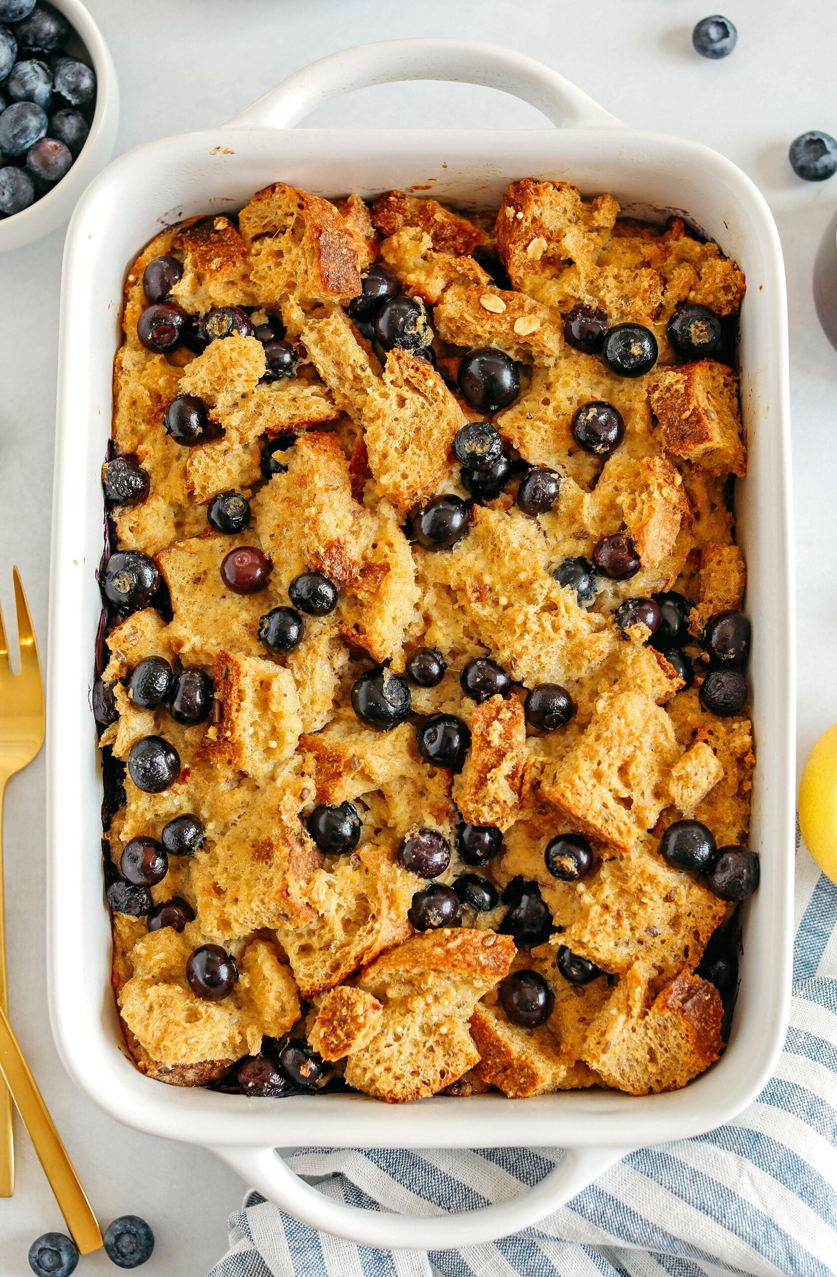 Warm and delicious Blueberry Lemon Bread Pudding lightened up with healthier ingredients and zero butter or refined sugar!  The perfect cozy dish for breakfast, brunch or dessert!